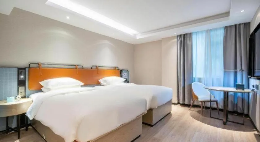 Bed in Echarm Hotel Guangzhou South Railway Station