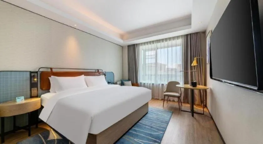 Bed in Echarm Hotel Guangzhou South Railway Station