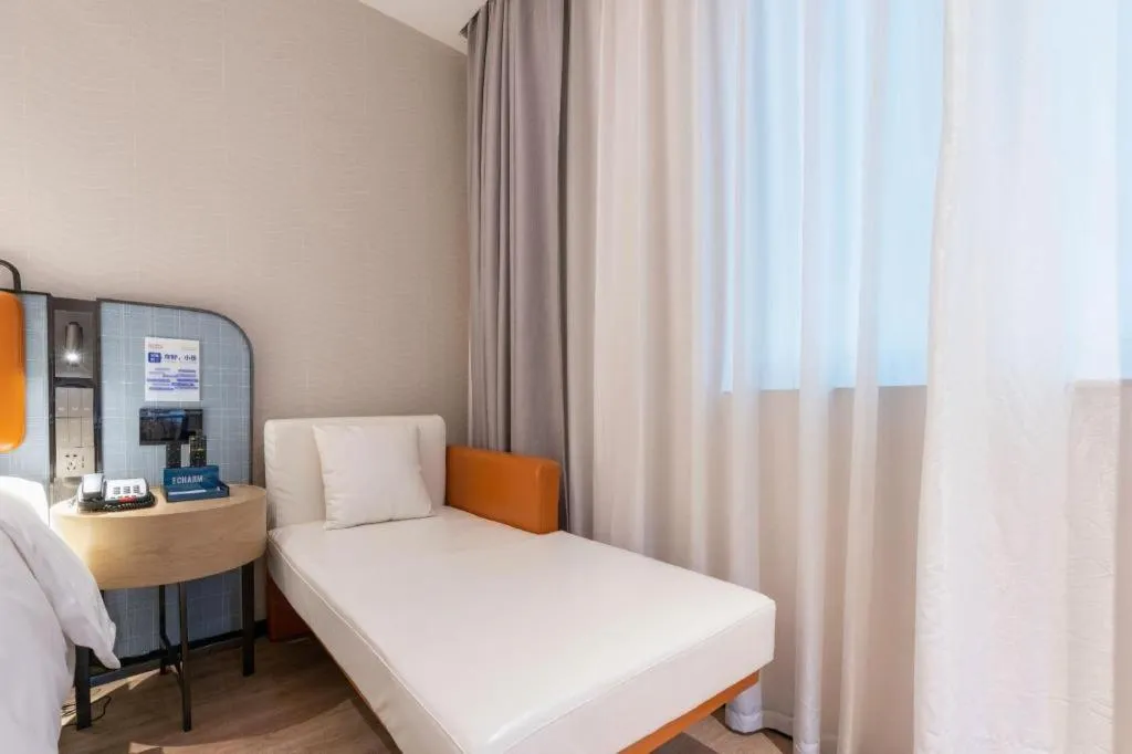 Bed in Echarm Hotel Guangzhou South Railway Station