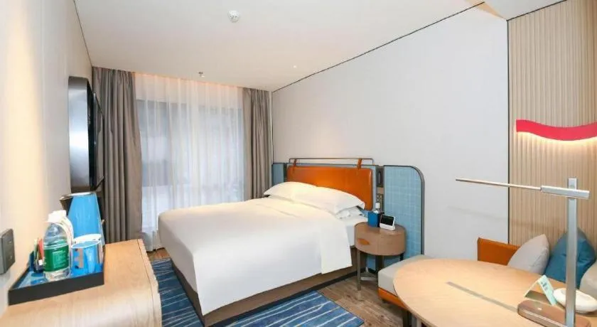 Bed in Echarm Hotel Guangzhou South Railway Station