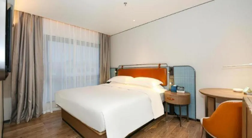 Bed in Echarm Hotel Guangzhou South Railway Station