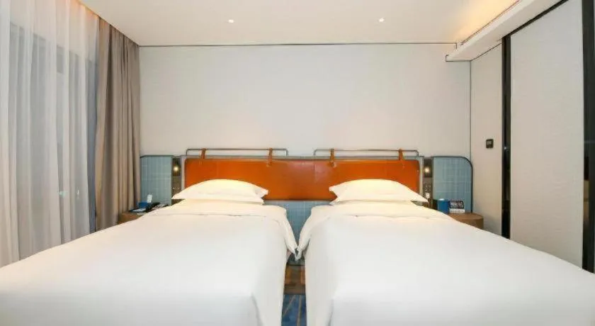 Bed in Echarm Hotel Guangzhou South Railway Station