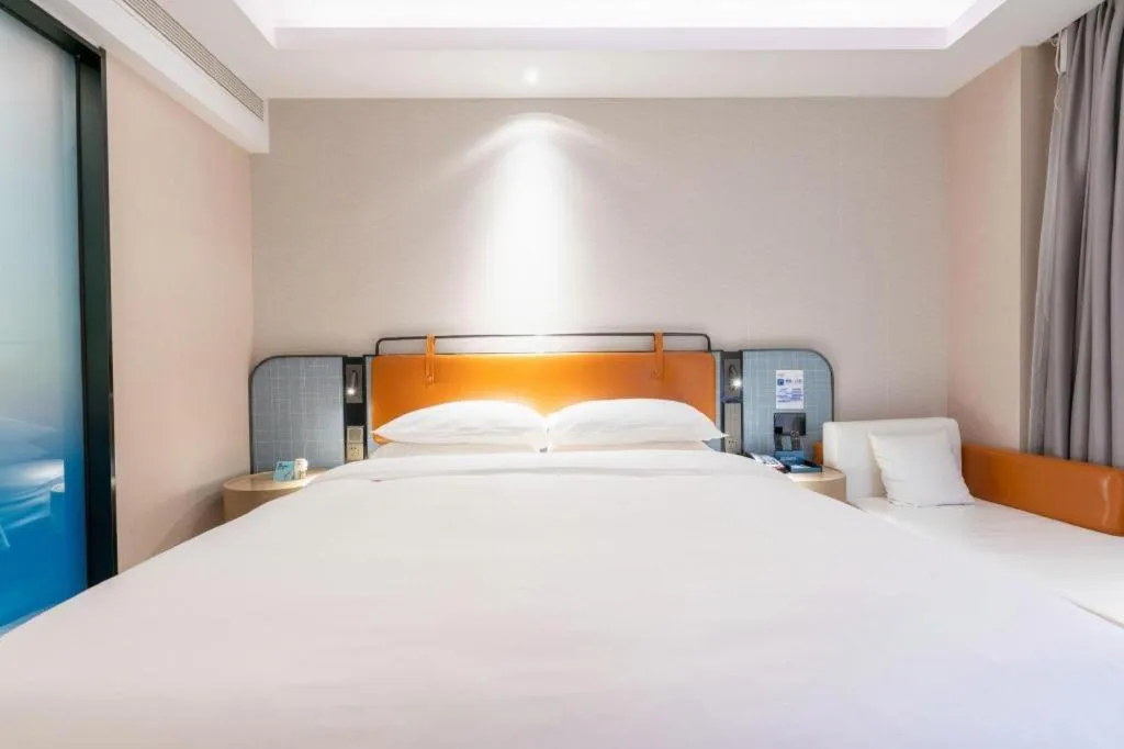 Bed in Echarm Hotel Guangzhou South Railway Station