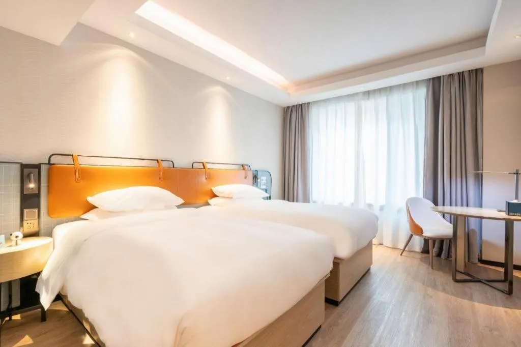 Bed in Echarm Hotel Guangzhou South Railway Station