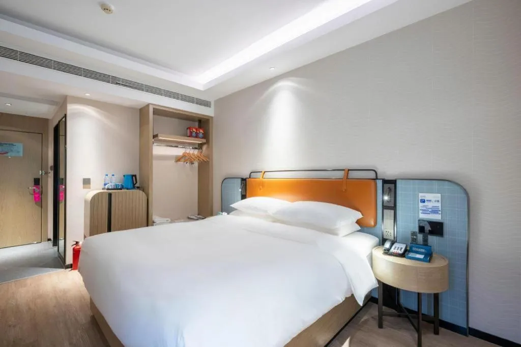 Bed in Echarm Hotel Guangzhou South Railway Station