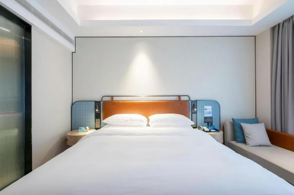 Bed in Echarm Hotel Guangzhou South Railway Station