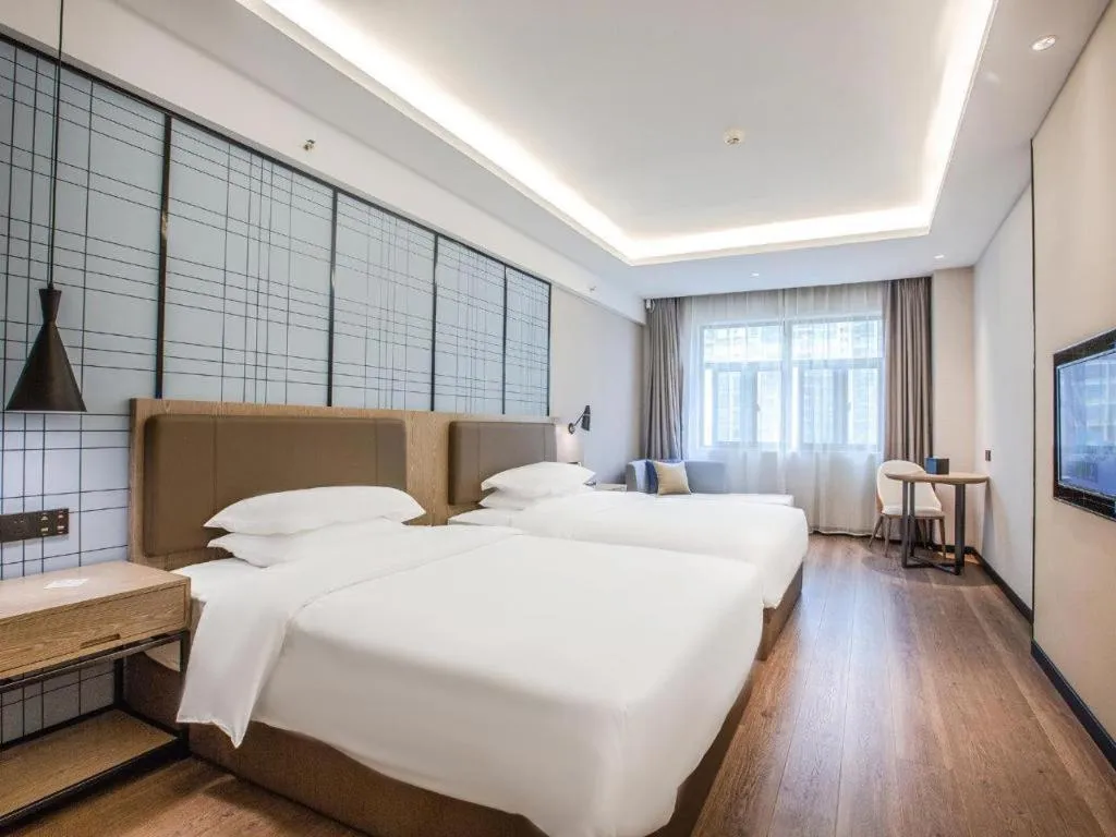 Bed in Echarm Hotel Changsha Yueliangdao Guanziling Metro Station