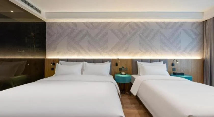 Bed in Borrman Hotel Beijing Guomao Jinsong Metro Station