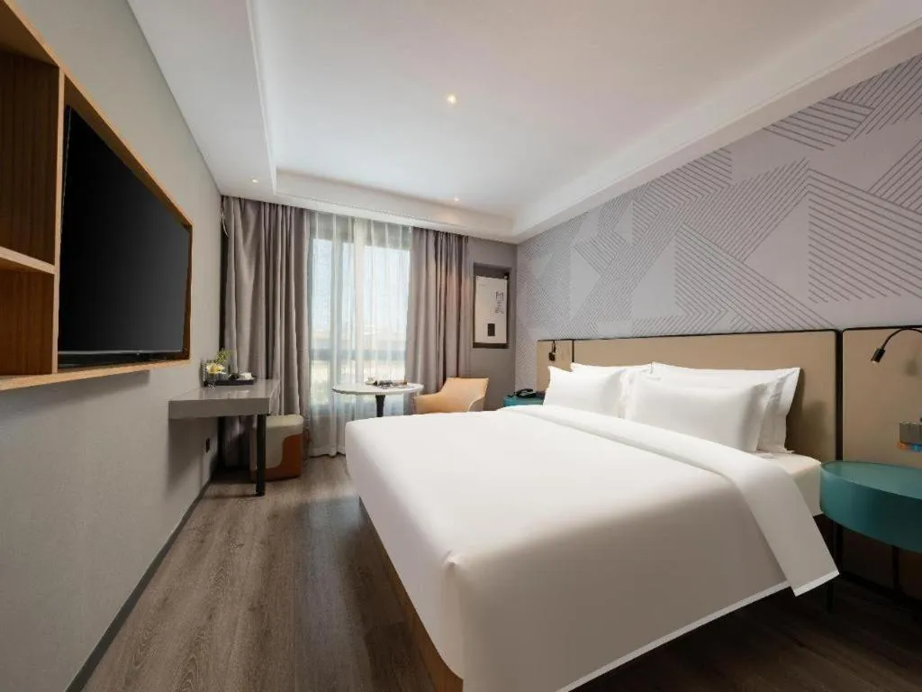 Bed in Borrman Hotel Beijing Guomao Jinsong Metro Station