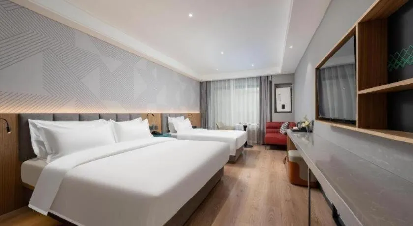 Bed in Borrman Hotel Beijing Guomao Jinsong Metro Station