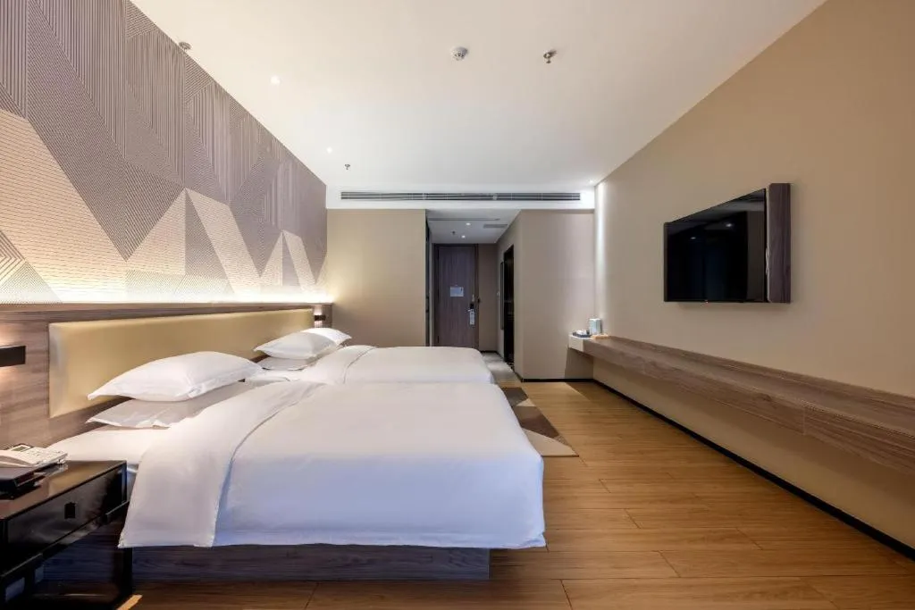 Bed in Borrman Hotel Korla Peacock River