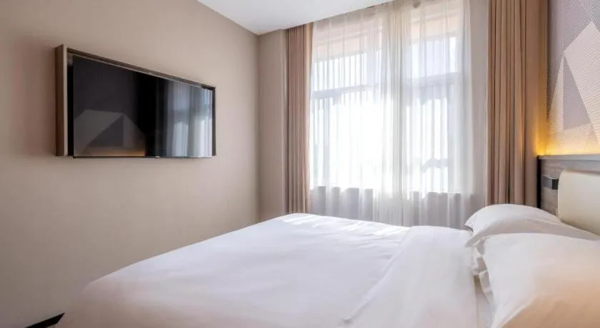 Bed in Borrman Hotel Korla Peacock River