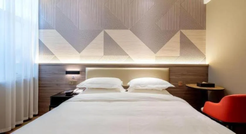 Bed in Borrman Hotel Korla Peacock River