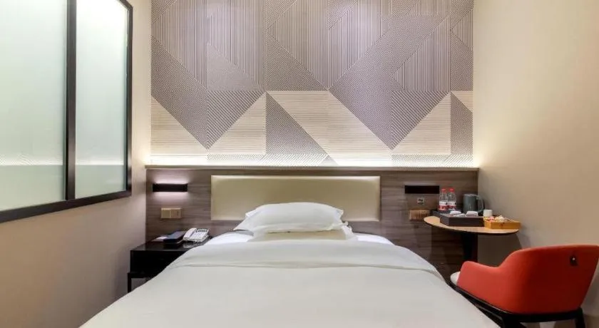 Bed in Borrman Hotel Korla Peacock River