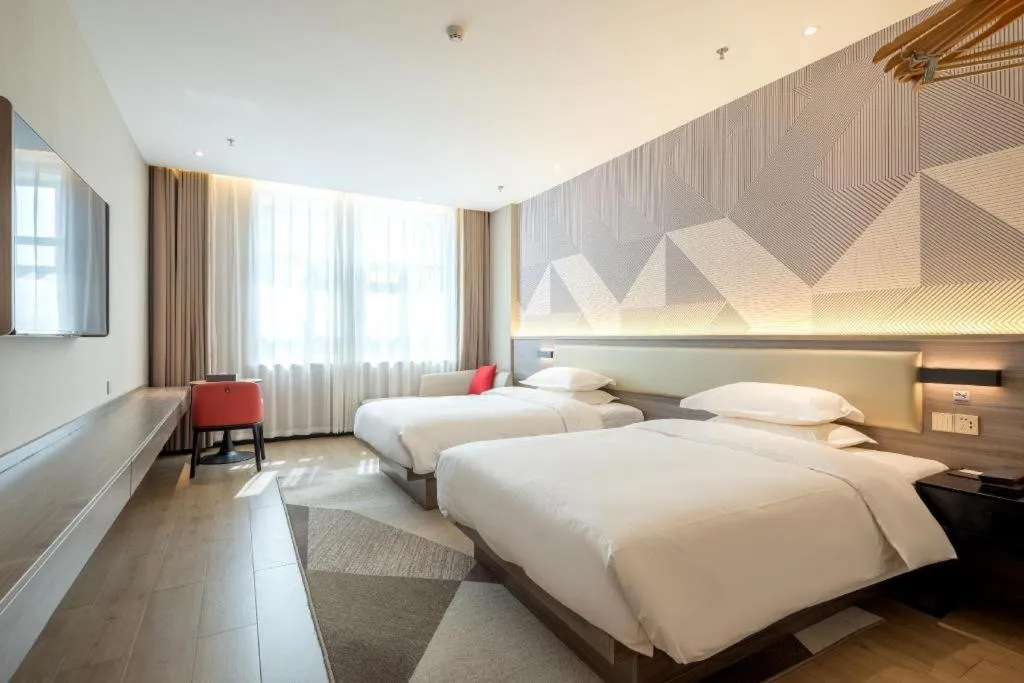 Bed in Borrman Hotel Korla Peacock River