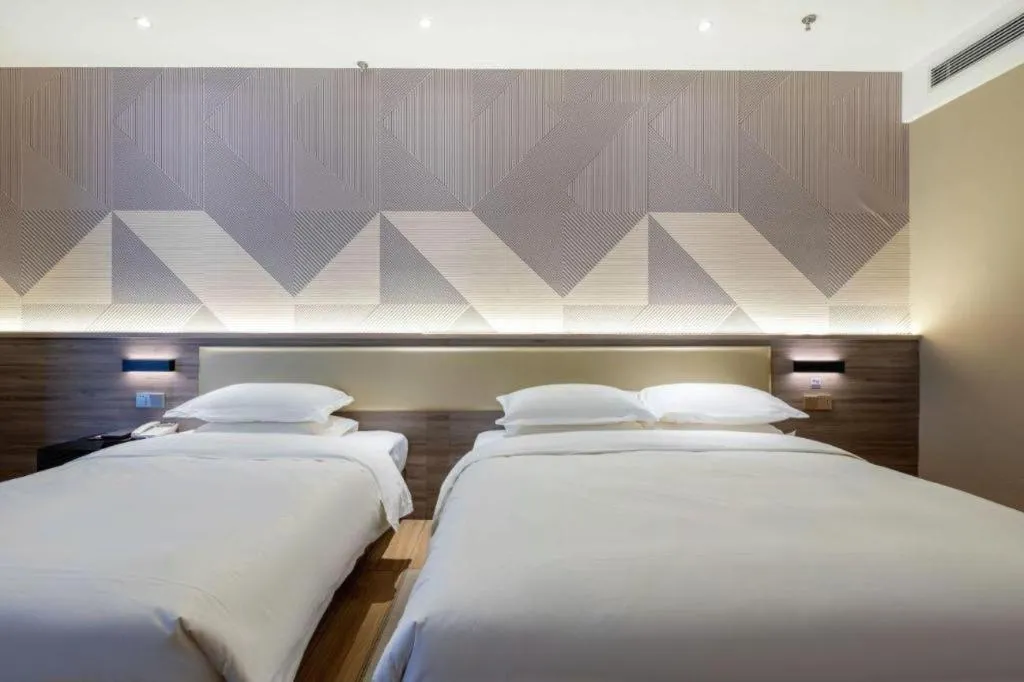 Bed in Borrman Hotel Korla Peacock River