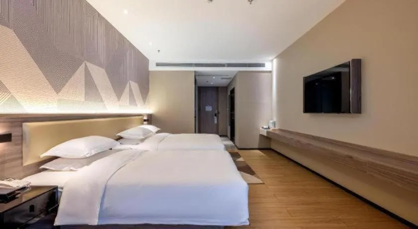 Bed in Borrman Hotel Korla Peacock River