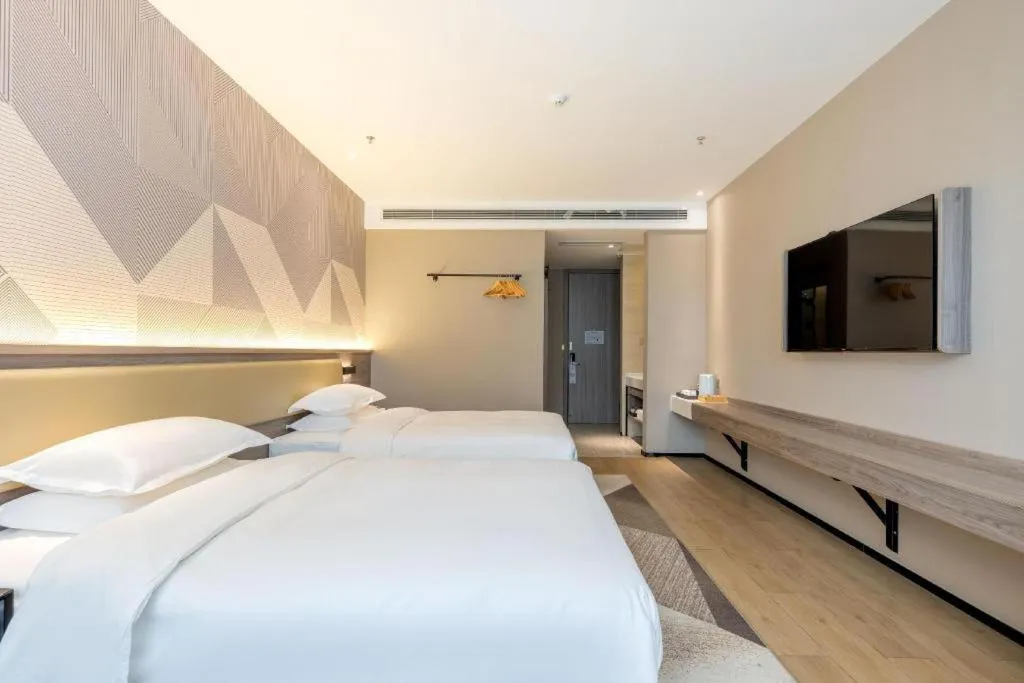 Bed in Borrman Hotel Korla Peacock River