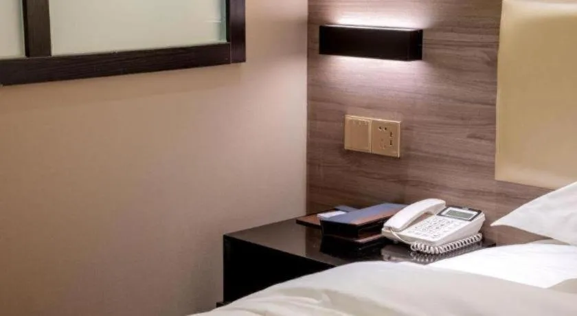 Bed in Borrman Hotel Korla Peacock River