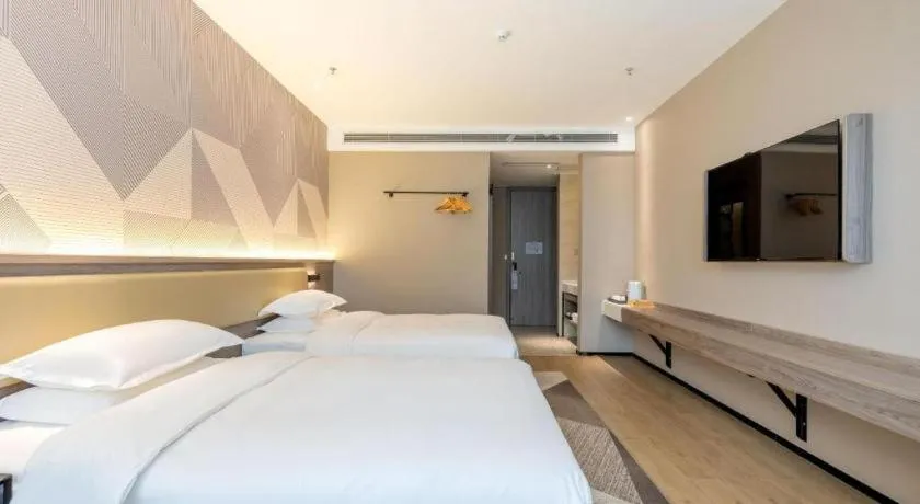 Bed in Borrman Hotel Korla Peacock River