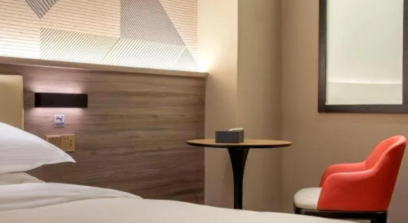 Bed in Borrman Hotel Korla Peacock River