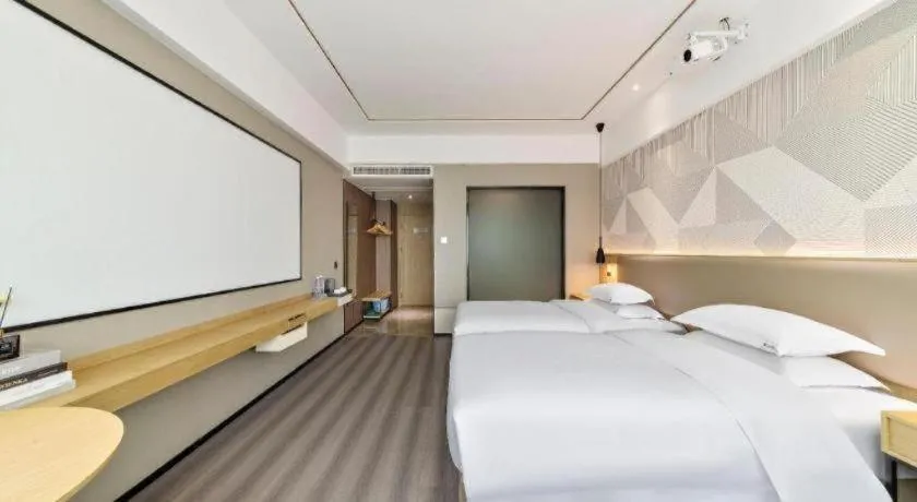 Bed in Borrman Hotel Wanning Wenming Road High-speed Railway Station