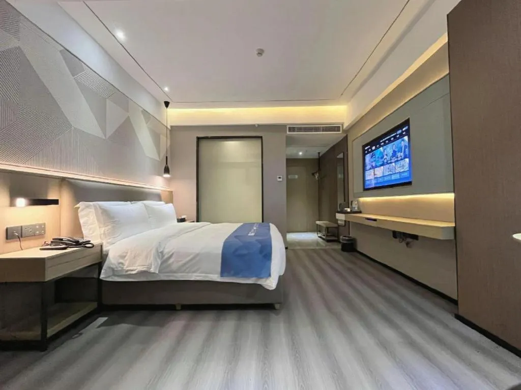 Bed in Borrman Hotel Wanning Wenming Road High-speed Railway Station