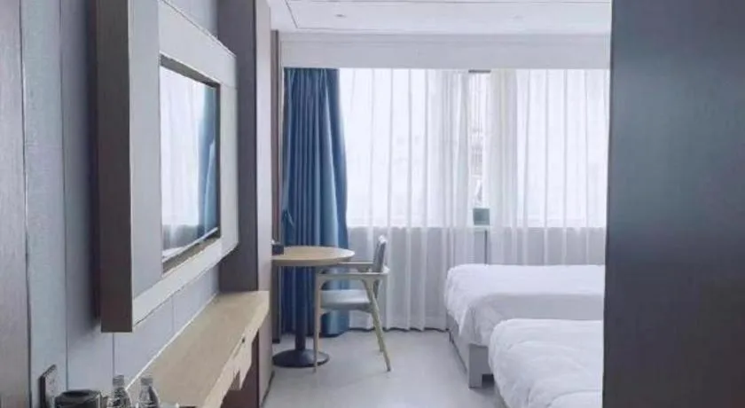 Bed in Borrman Hotel Wanning Wenming Road High-speed Railway Station