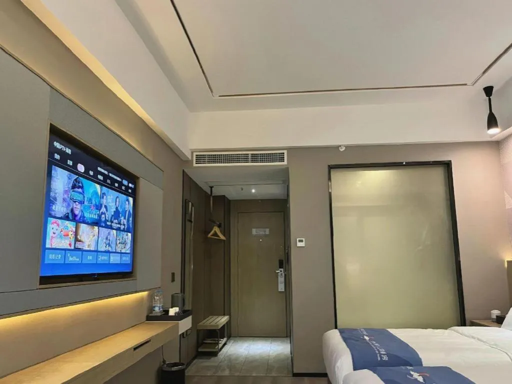 Bed in Borrman Hotel Wanning Wenming Road High-speed Railway Station