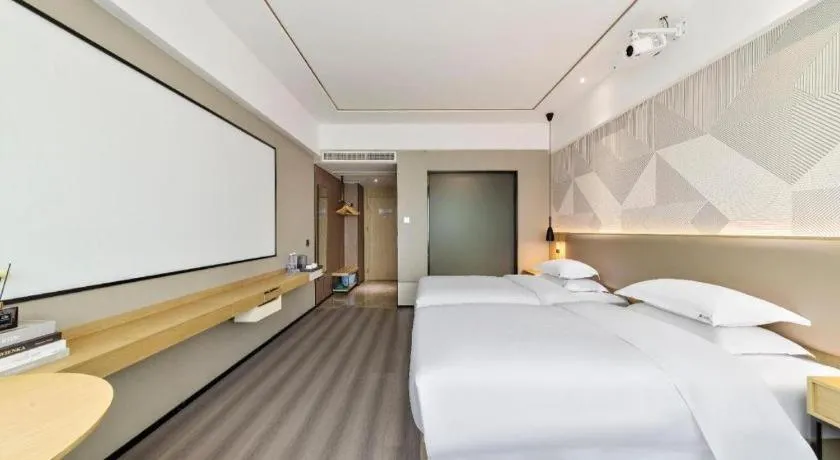 Bed in Borrman Hotel Wanning Wenming Road High-speed Railway Station