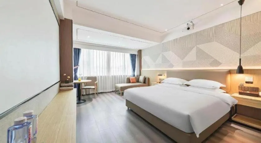 Bed in Borrman Hotel Wanning Wenming Road High-speed Railway Station