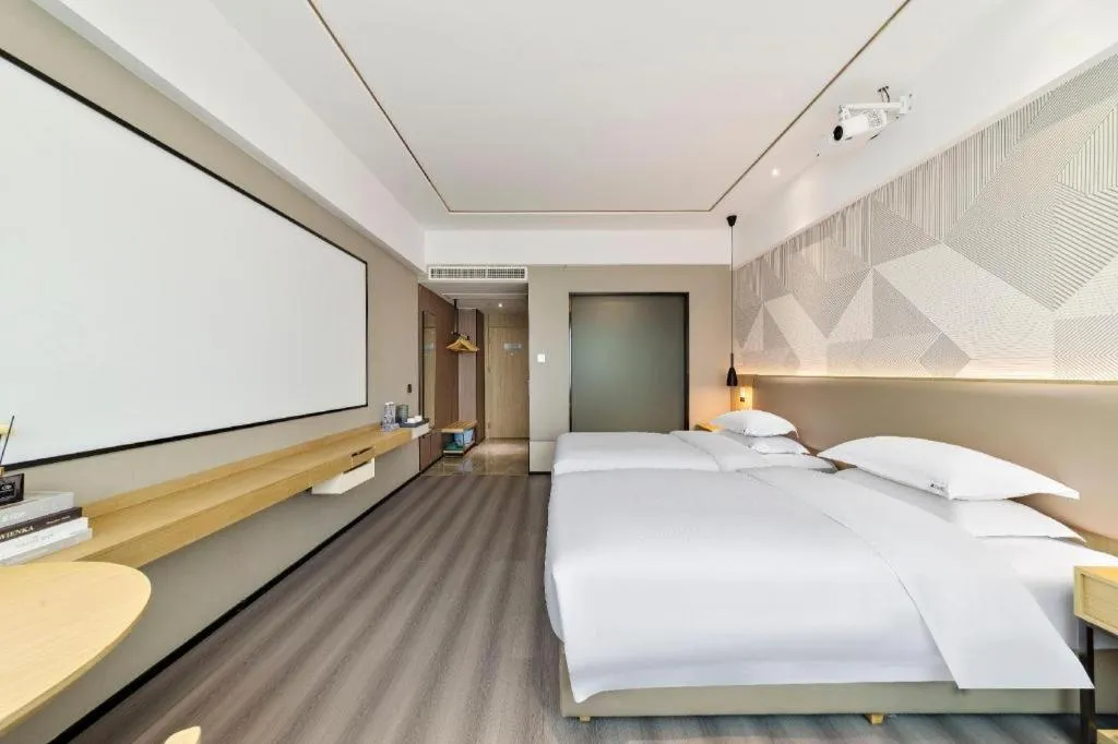 Bed in Borrman Hotel Wanning Wenming Road High-speed Railway Station