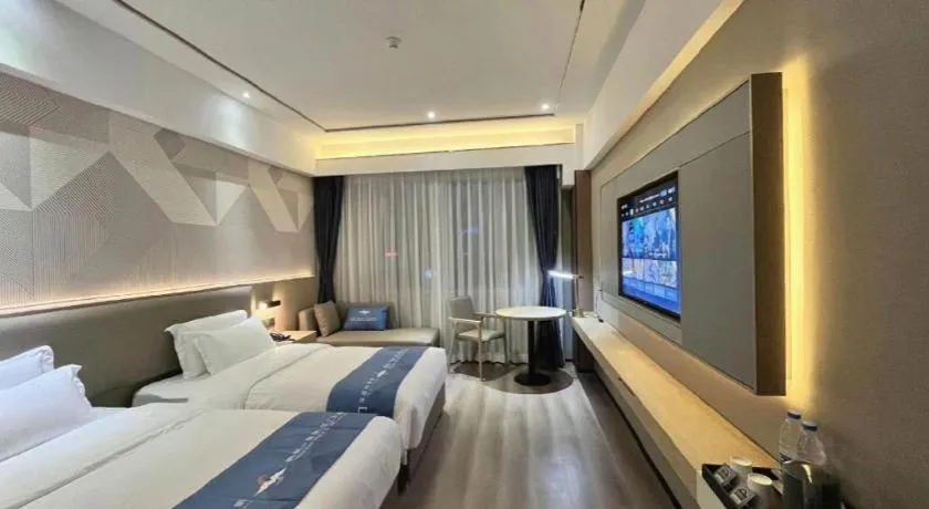 Bed in Borrman Hotel Wanning Wenming Road High-speed Railway Station