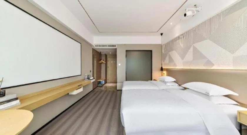 Bed in Borrman Hotel Wanning Wenming Road High-speed Railway Station