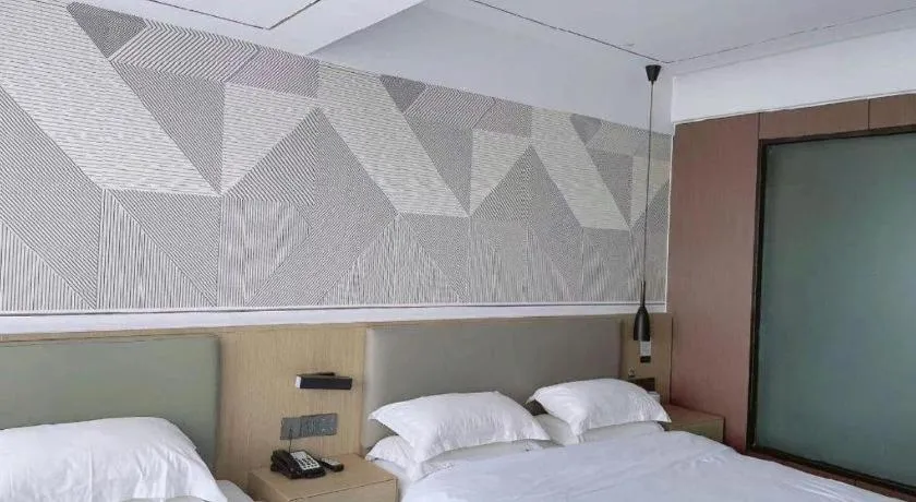 Bed in Borrman Hotel Wanning Wenming Road High-speed Railway Station