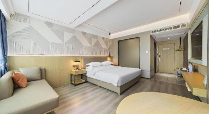 Bed in Borrman Hotel Wanning Wenming Road High-speed Railway Station