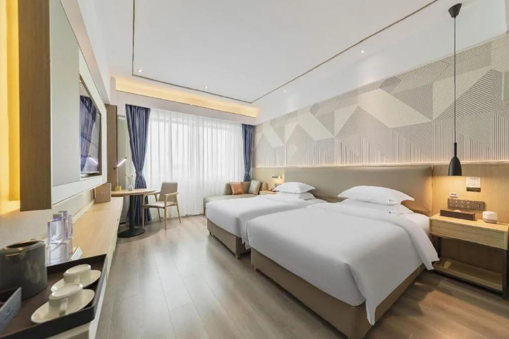 Bed in Borrman Hotel Wanning Wenming Road High-speed Railway Station