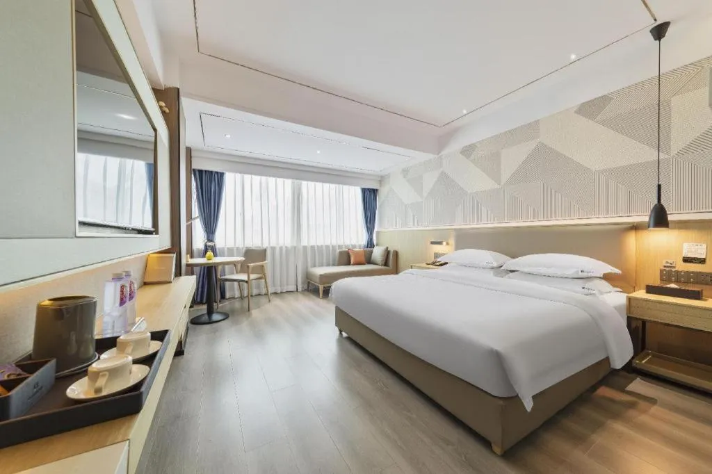 Bed in Borrman Hotel Wanning Wenming Road High-speed Railway Station