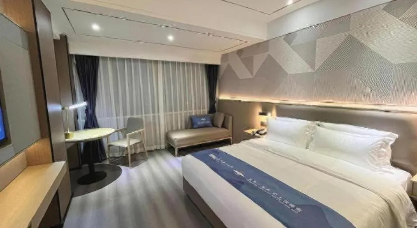 Bed in Borrman Hotel Wanning Wenming Road High-speed Railway Station