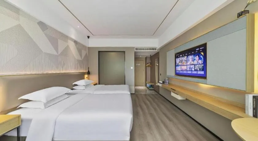 Bed in Borrman Hotel Wanning Wenming Road High-speed Railway Station