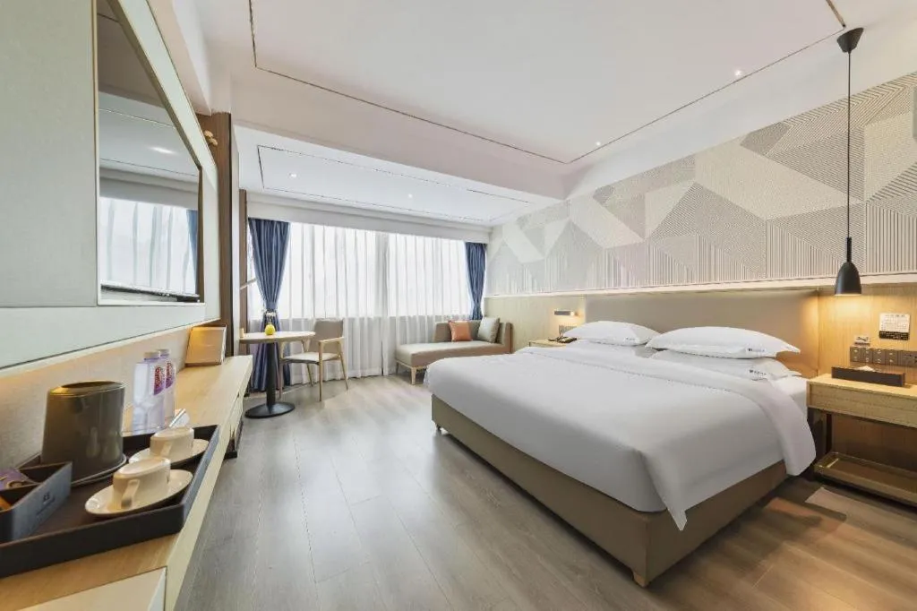 Bed in Borrman Hotel Wanning Wenming Road High-speed Railway Station