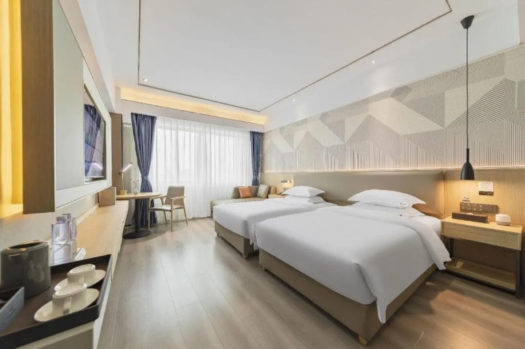 Bed in Borrman Hotel Wanning Wenming Road High-speed Railway Station