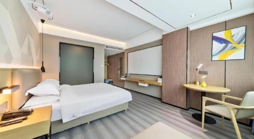 Bed in Borrman Hotel Wanning Wenming Road High-speed Railway Station