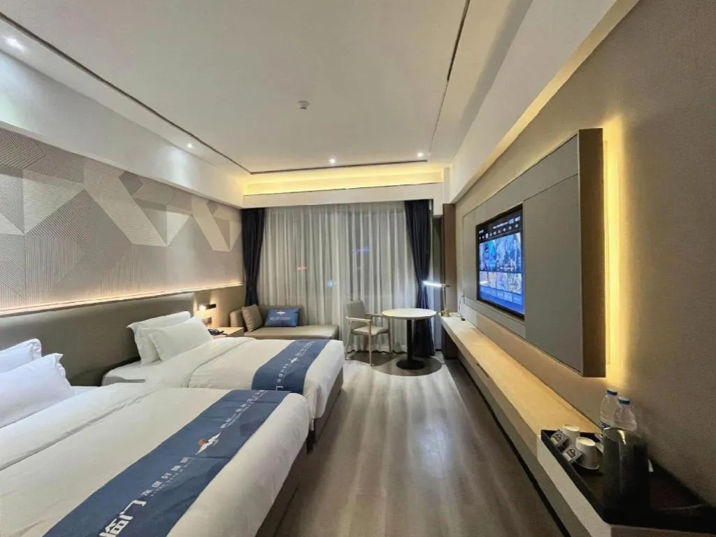 Bed in Borrman Hotel Wanning Wenming Road High-speed Railway Station