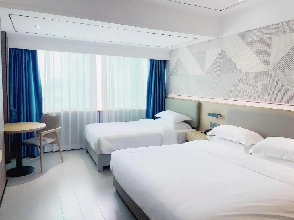 Bed in Borrman Hotel Wanning Wenming Road High-speed Railway Station