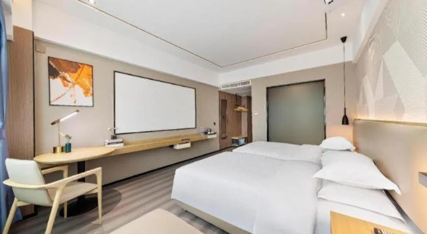 Bed in Borrman Hotel Wanning Wenming Road High-speed Railway Station