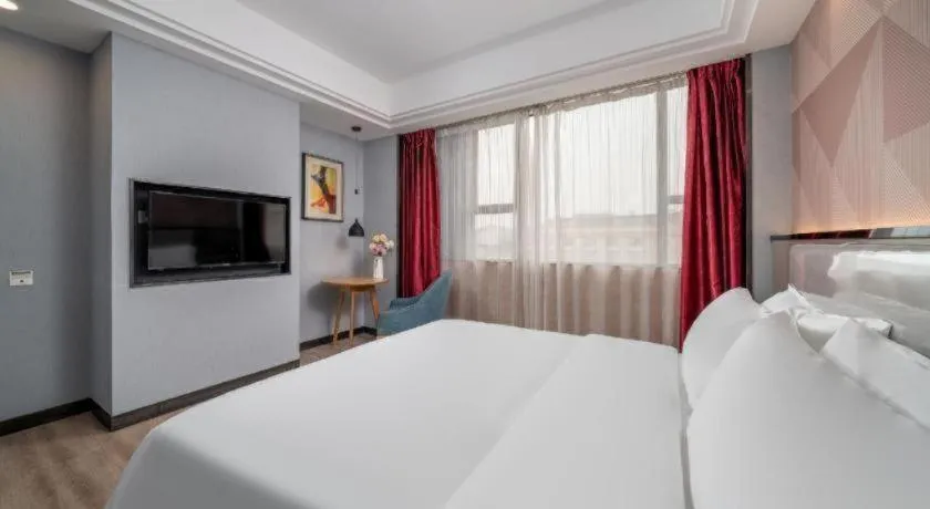 Bed in Borrman Hotel Guangzhou Xinshi Baixin Plaza Qifu Road