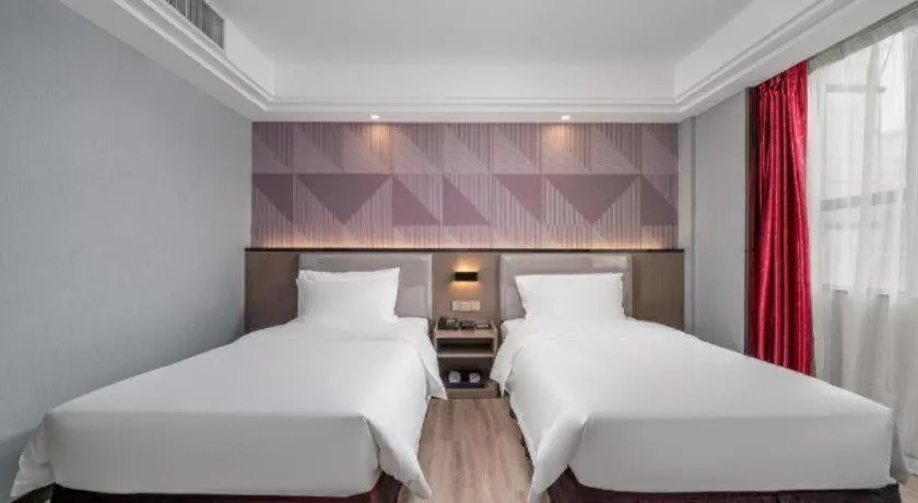 Bed in Borrman Hotel Guangzhou Xinshi Baixin Plaza Qifu Road