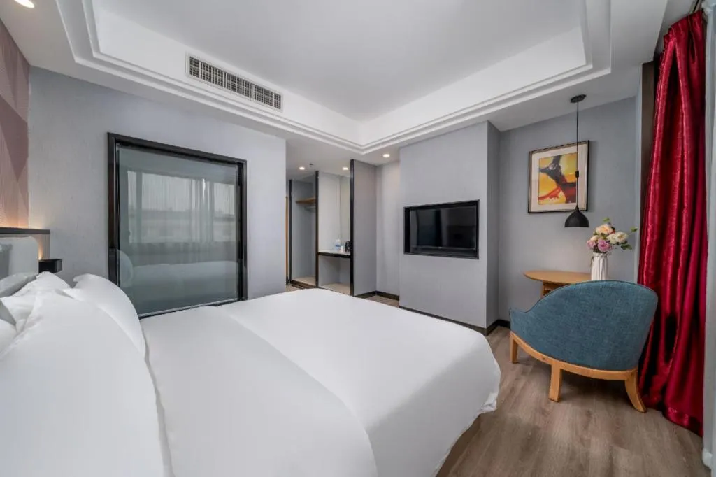 Bed in Borrman Hotel Guangzhou Xinshi Baixin Plaza Qifu Road