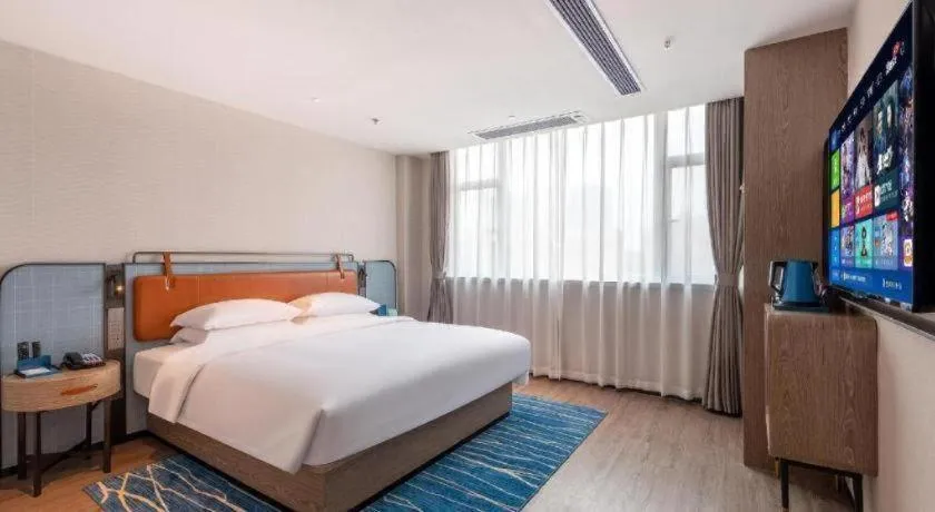 Bed in Echarm Hotel Guangzhou North Station Cultural Tourism City